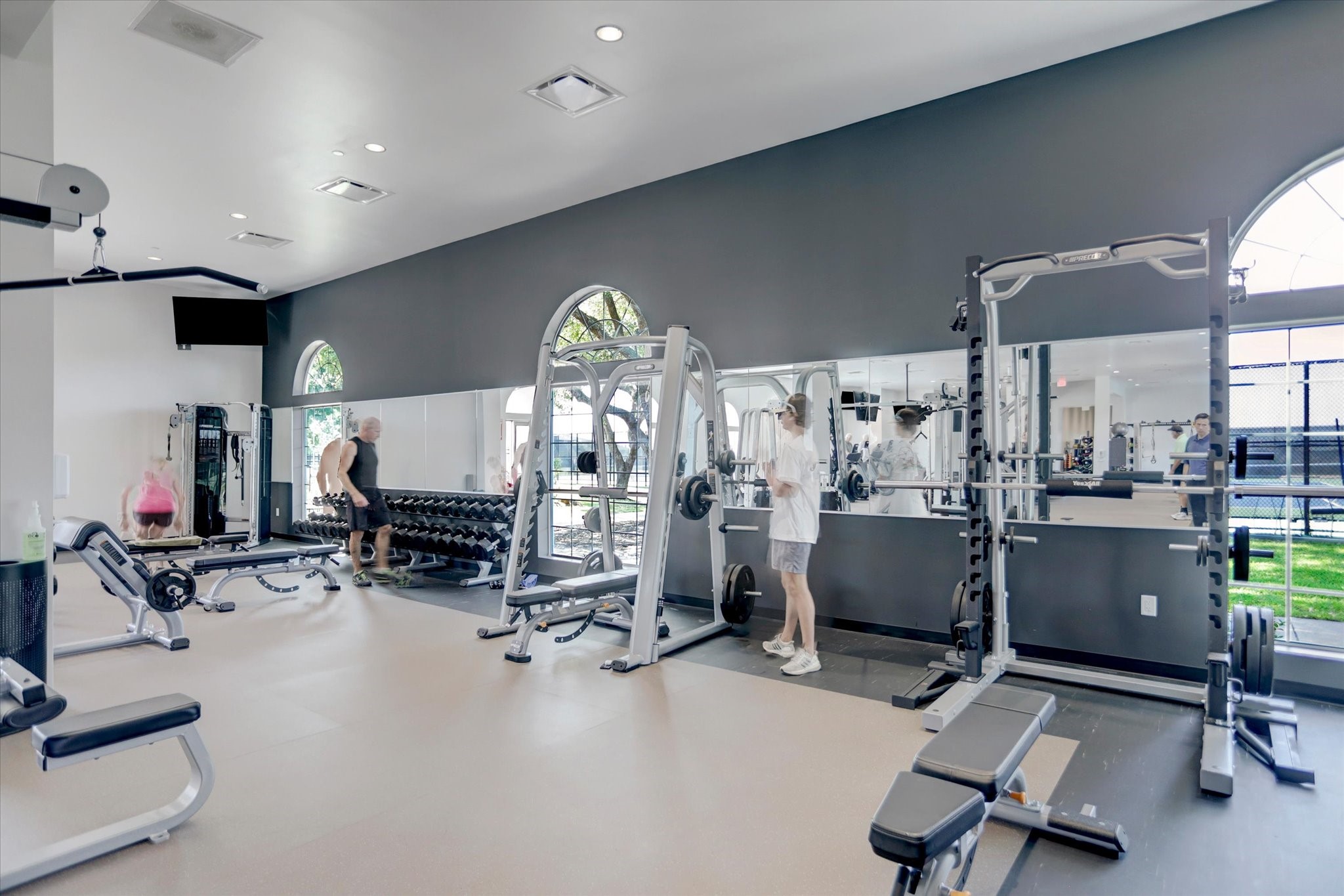 203 Hampton Glen Road Montgomery, TX 77356 - Photo 33 of 35 Bentwater residents enjoy access to a well-equipped fitness center featuring cardio and strength training equipment, providing a convenient option for maintaining an active lifestyle within the community.
