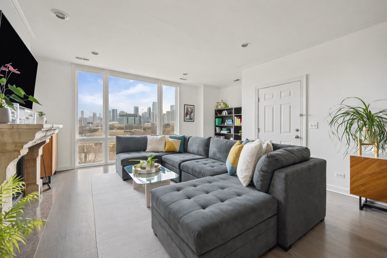 618 North May Street, Unit C Chicago, IL 60642 - Photo 2 of 30 a living room with furniture fireplace and a flat screen tv