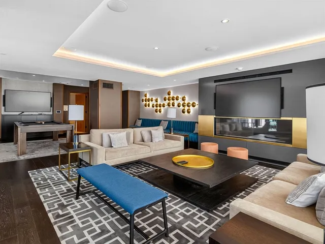 a living room with furniture and a rug