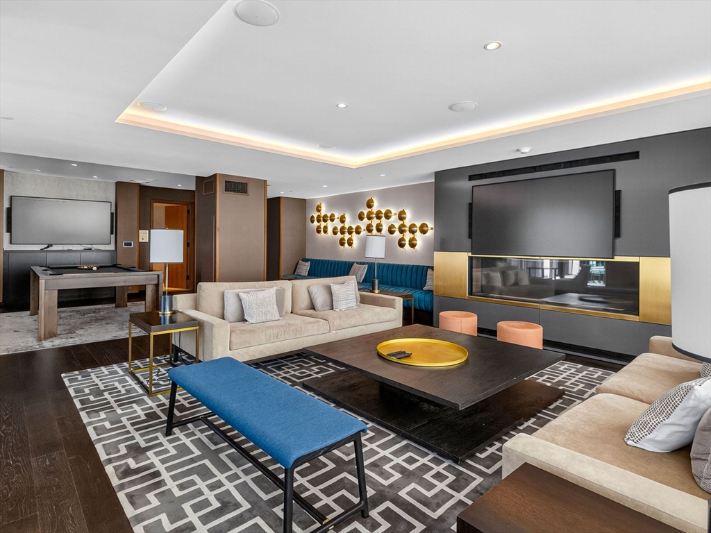 135 Seaport Boulevard, Unit 1907 Boston, MA 02210 - Photo 12 of 13 a living room with furniture and a rug