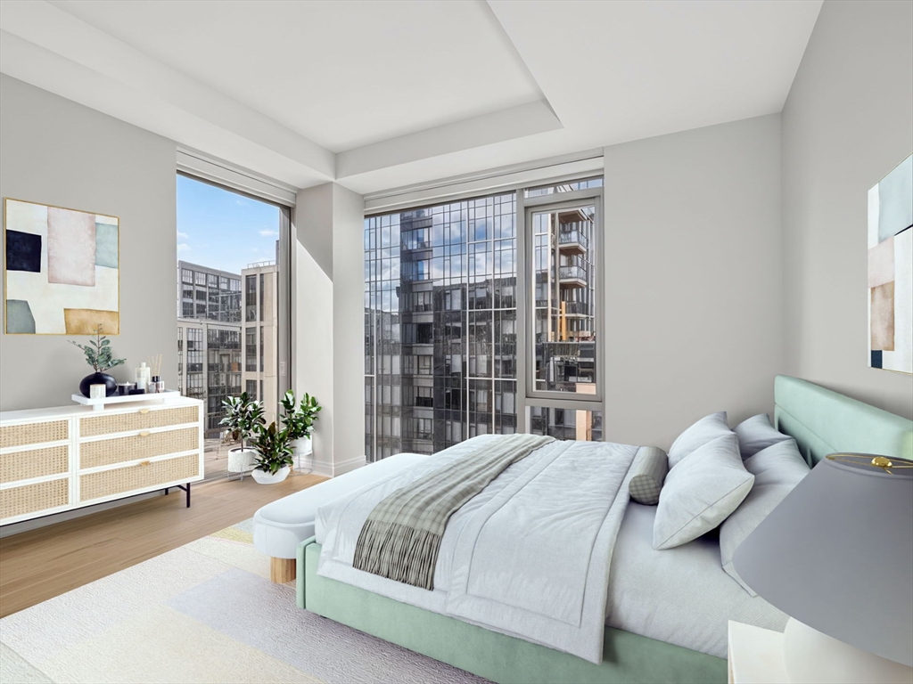135 Seaport Boulevard, Unit 1907 Boston, MA 02210 - Photo 6 of 13 a spacious bedroom with a bed and a large window