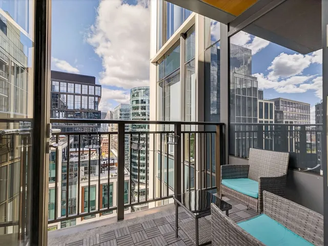 a view of a balcony with wooden floor