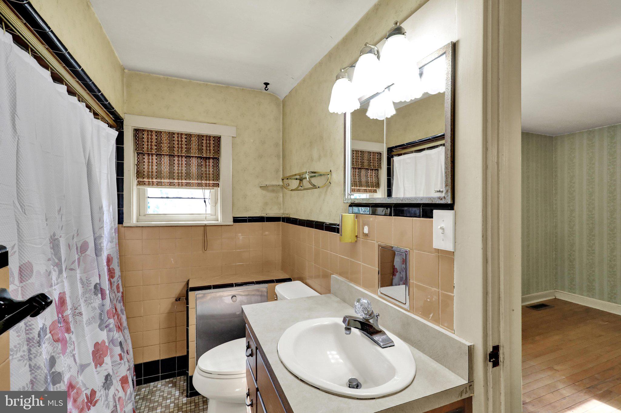 24 Ardmore Avenue Reading, PA 19607 - Photo 22 of 40 a bathroom with a sink a toilet and mirror