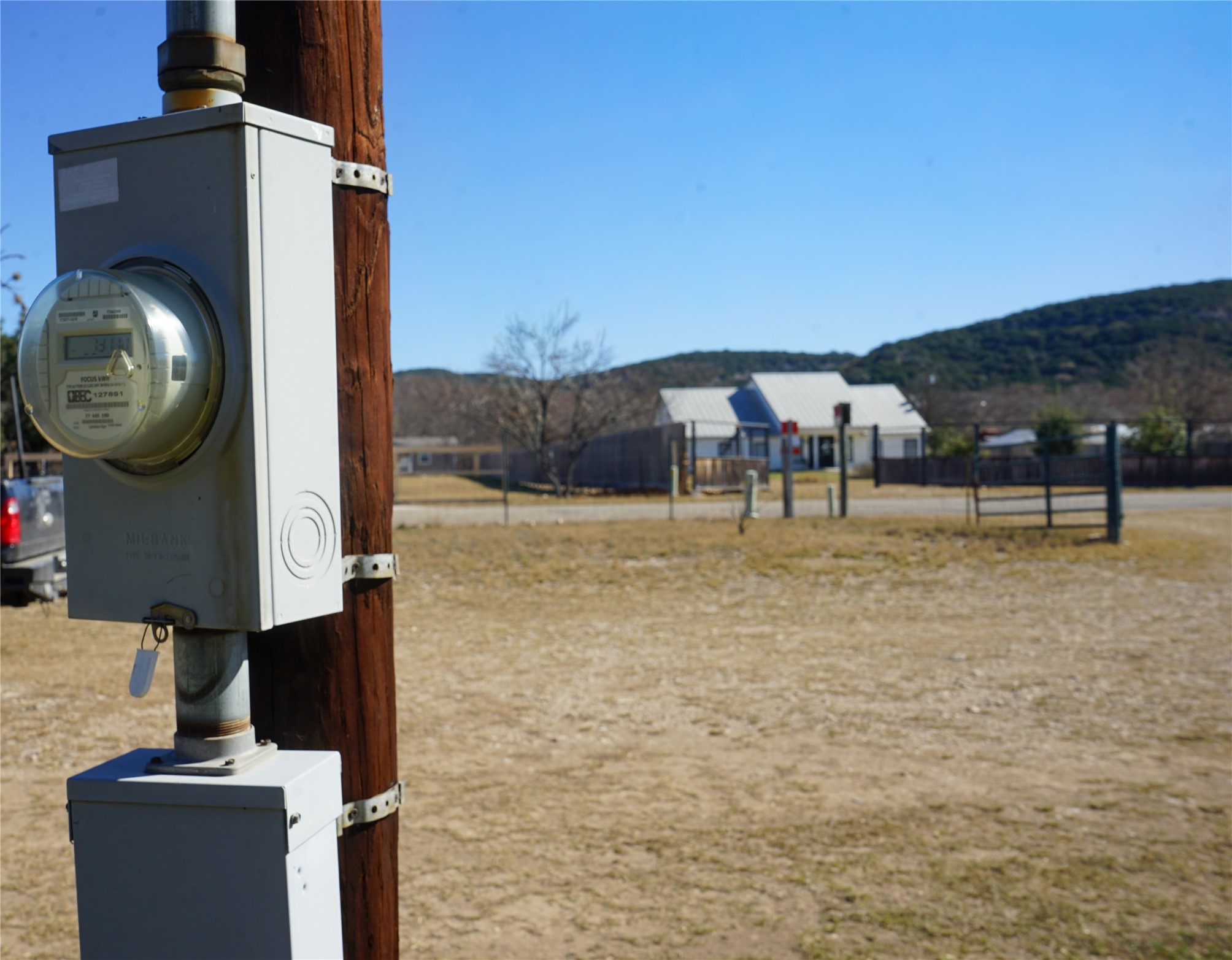 831 Magers Road Concan, TX 78838 - Photo 12 of 39 Exterior view of electric meter and mountains