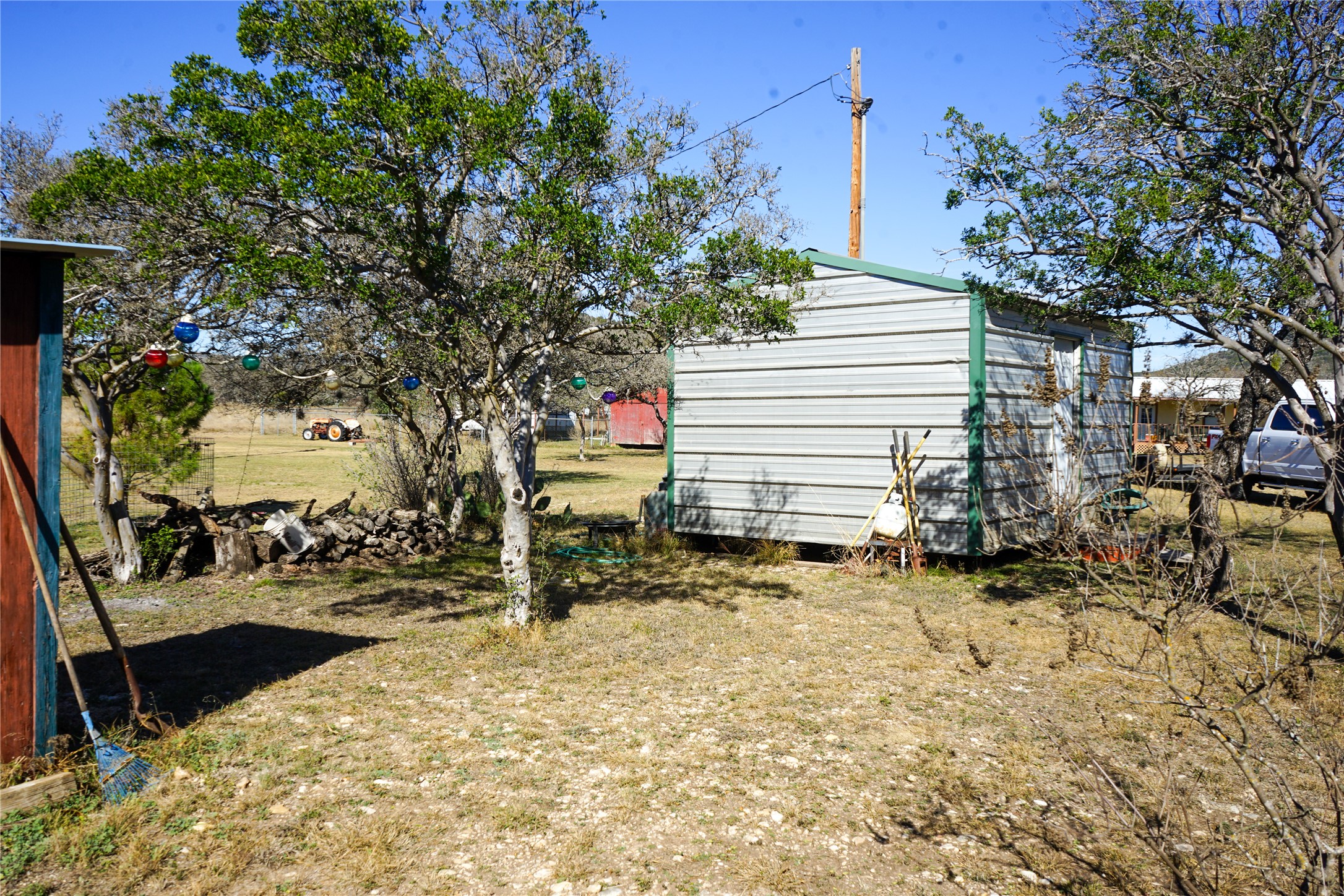831 Magers Road Concan, TX 78838 - Photo 17 of 39 View of yard with a storage shed