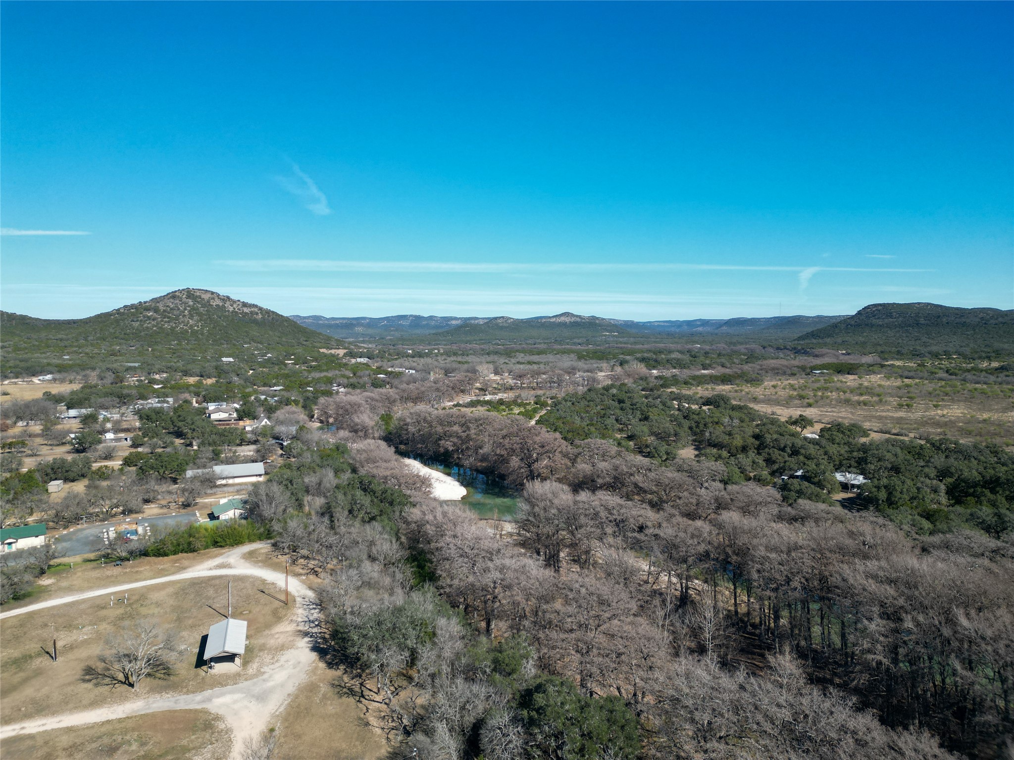831 Magers Road Concan, TX 78838 - Photo 2 of 39 Aerial view of a mountainous background