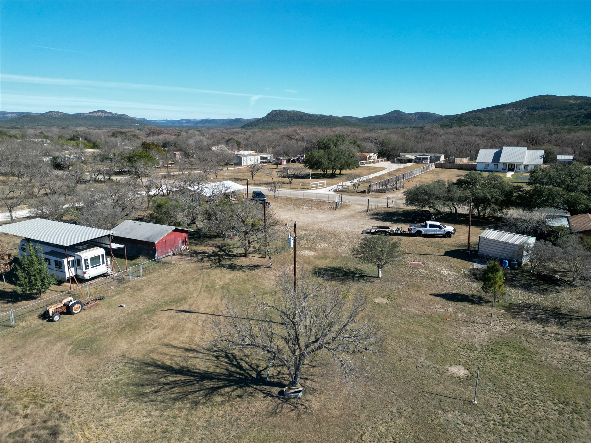 831 Magers Road Concan, TX 78838 - Photo 4 of 39 Aerial view of sparsely populated area with mountains