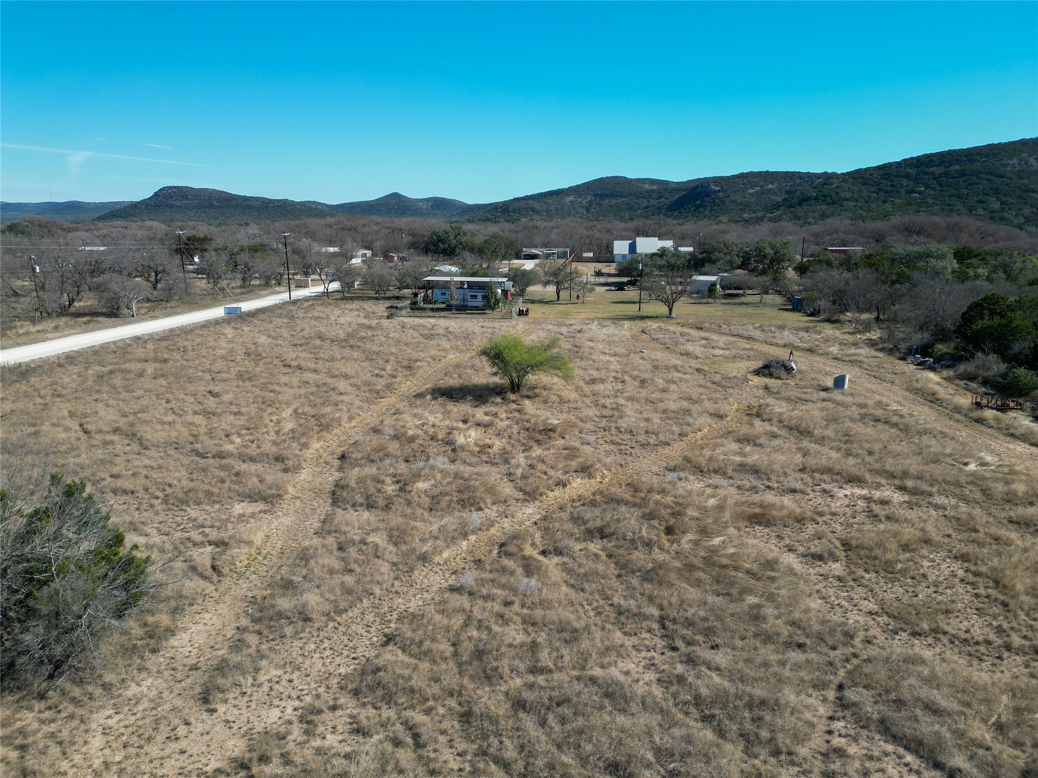 831 Magers Road Concan, TX 78838 - Photo 5 of 39 View of mountain backdrop with rural landscape