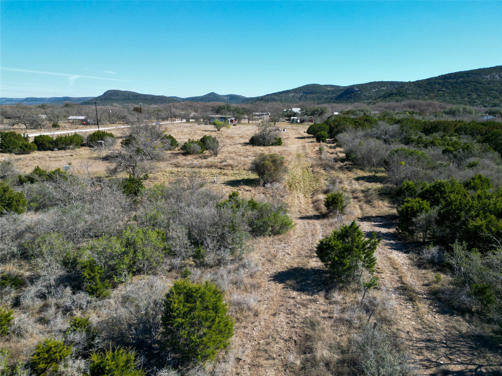 831 Magers Road Concan, TX 78838 - Photo 6 of 39 View of mountain background featuring rural landscape