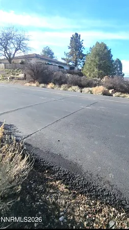 a view of a road with an ocean view