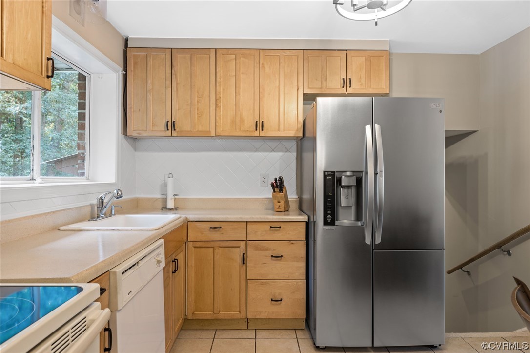 1601 Olde Coalmine Road Midlothian, VA 23113 - Photo 14 of 40 a kitchen with a sink dishwasher a refrigerator a stove and a refrigerator with wooden floor