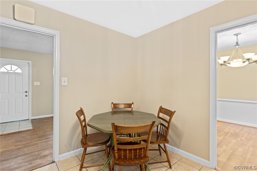 1601 Olde Coalmine Road Midlothian, VA 23113 - Photo 15 of 40 a view of a dining room with furniture and wooden floor