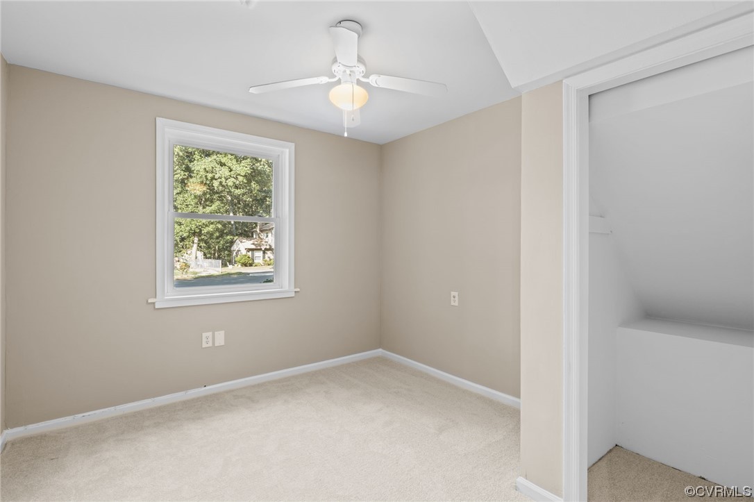 1601 Olde Coalmine Road Midlothian, VA 23113 - Photo 19 of 40 an empty room with windows and ceiling fan