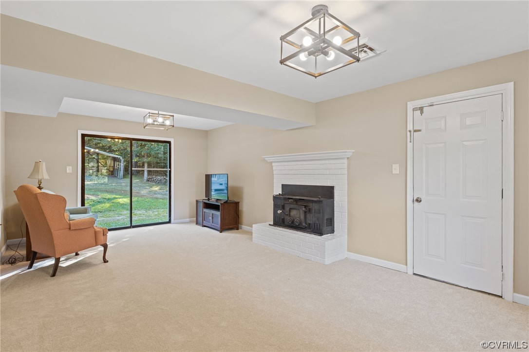 1601 Olde Coalmine Road Midlothian, VA 23113 - Photo 20 of 40 a view of a livingroom with a fireplace a window and a couch
