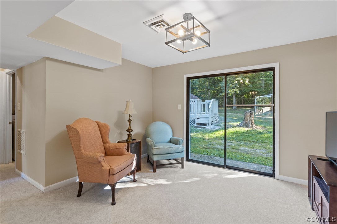 1601 Olde Coalmine Road Midlothian, VA 23113 - Photo 23 of 40 a living room with furniture and a floor to ceiling window