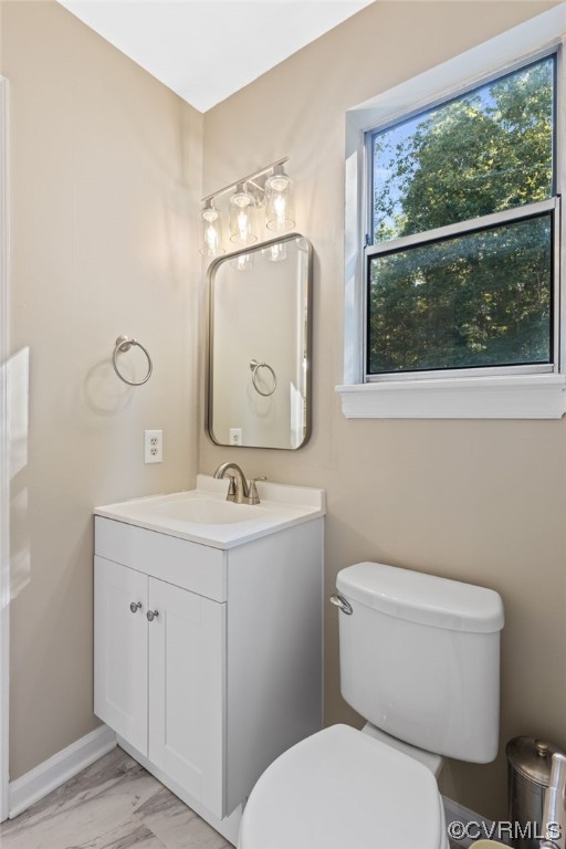 1601 Olde Coalmine Road Midlothian, VA 23113 - Photo 30 of 40 a bathroom with a toilet a sink and a mirror