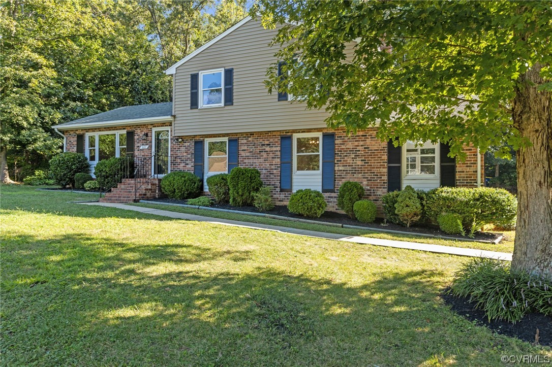 1601 Olde Coalmine Road Midlothian, VA 23113 - Photo 3 of 40 a front view of a house with garden