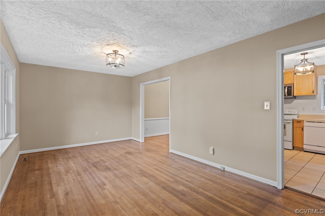 1601 Olde Coalmine Road Midlothian, VA 23113 - Photo 8 of 40 wooden floor in an empty room with a window