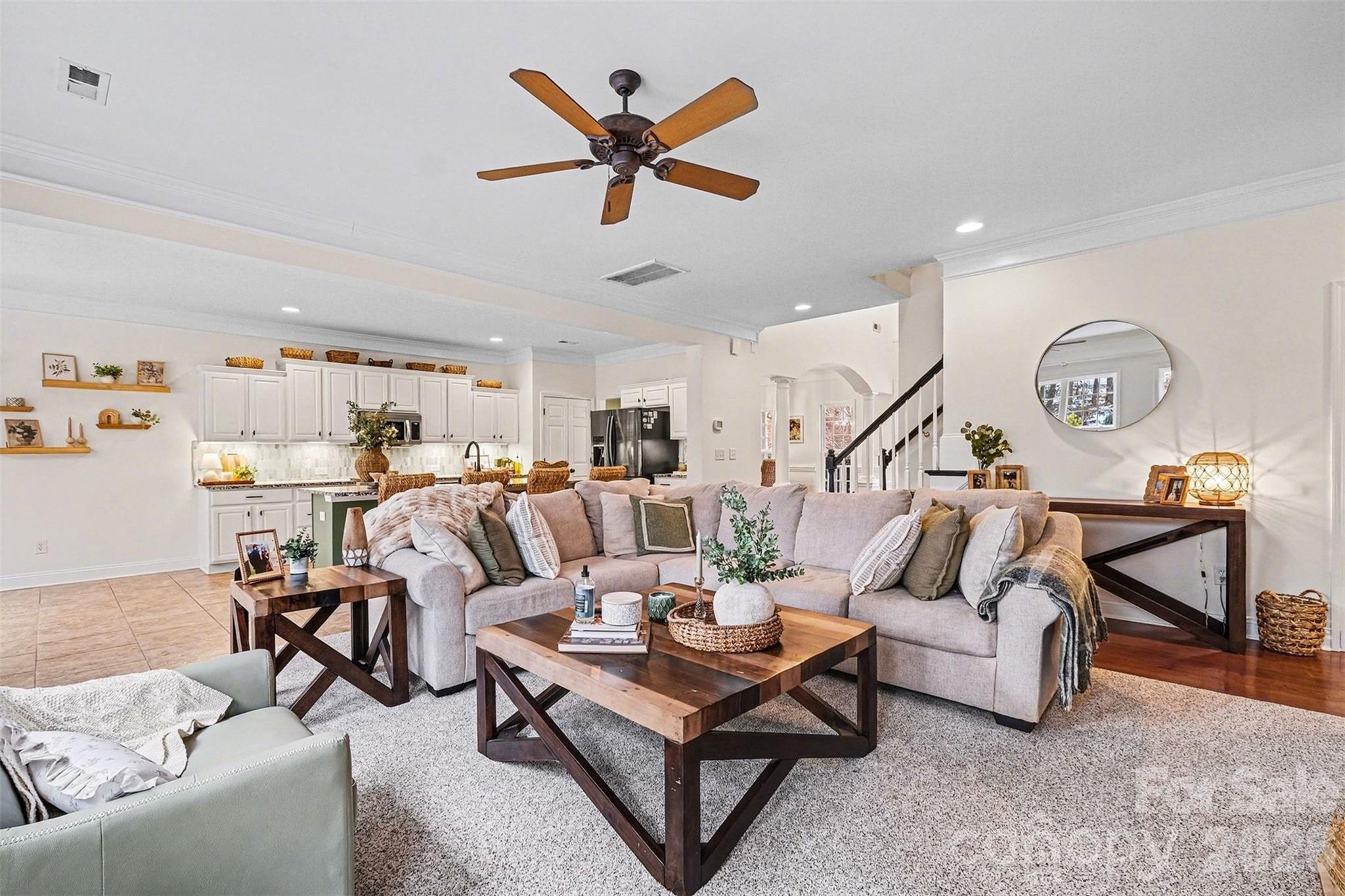126 Burtons Barn Road Mooresville, NC 28115 - Photo 13 of 48 a living room with furniture and kitchen view