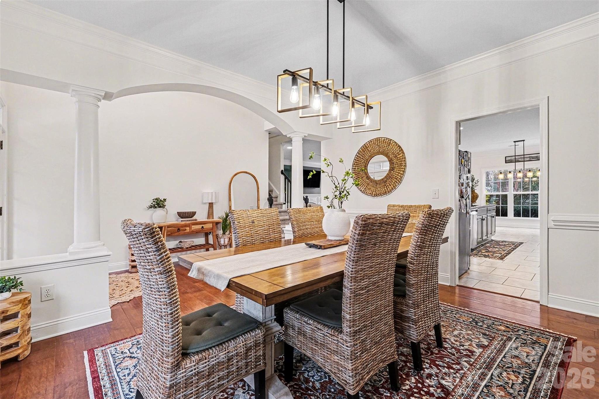 126 Burtons Barn Road Mooresville, NC 28115 - Photo 15 of 48 a view of a dining room with furniture window and wooden floor
