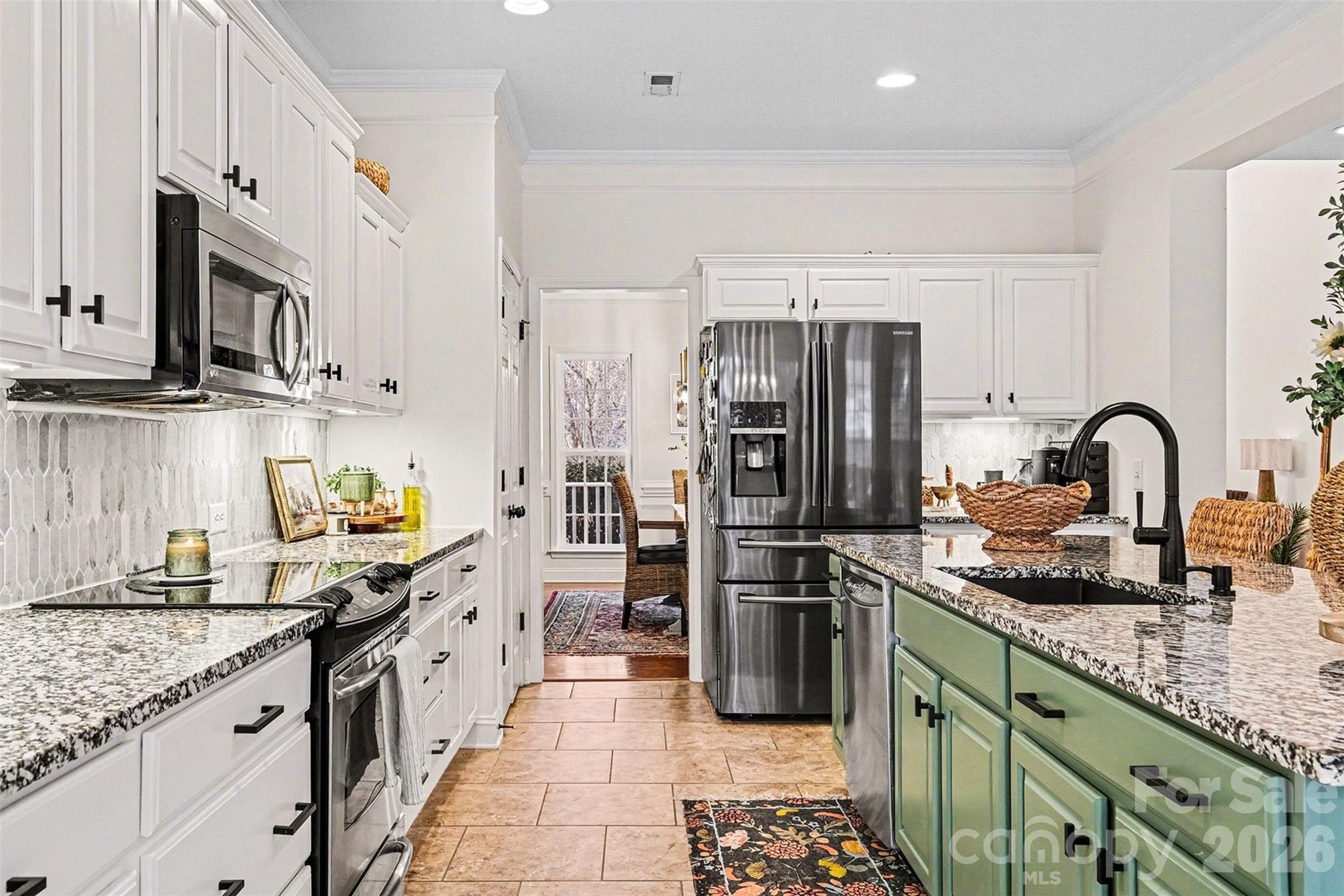 126 Burtons Barn Road Mooresville, NC 28115 - Photo 18 of 48 a kitchen with granite countertop a refrigerator and a sink