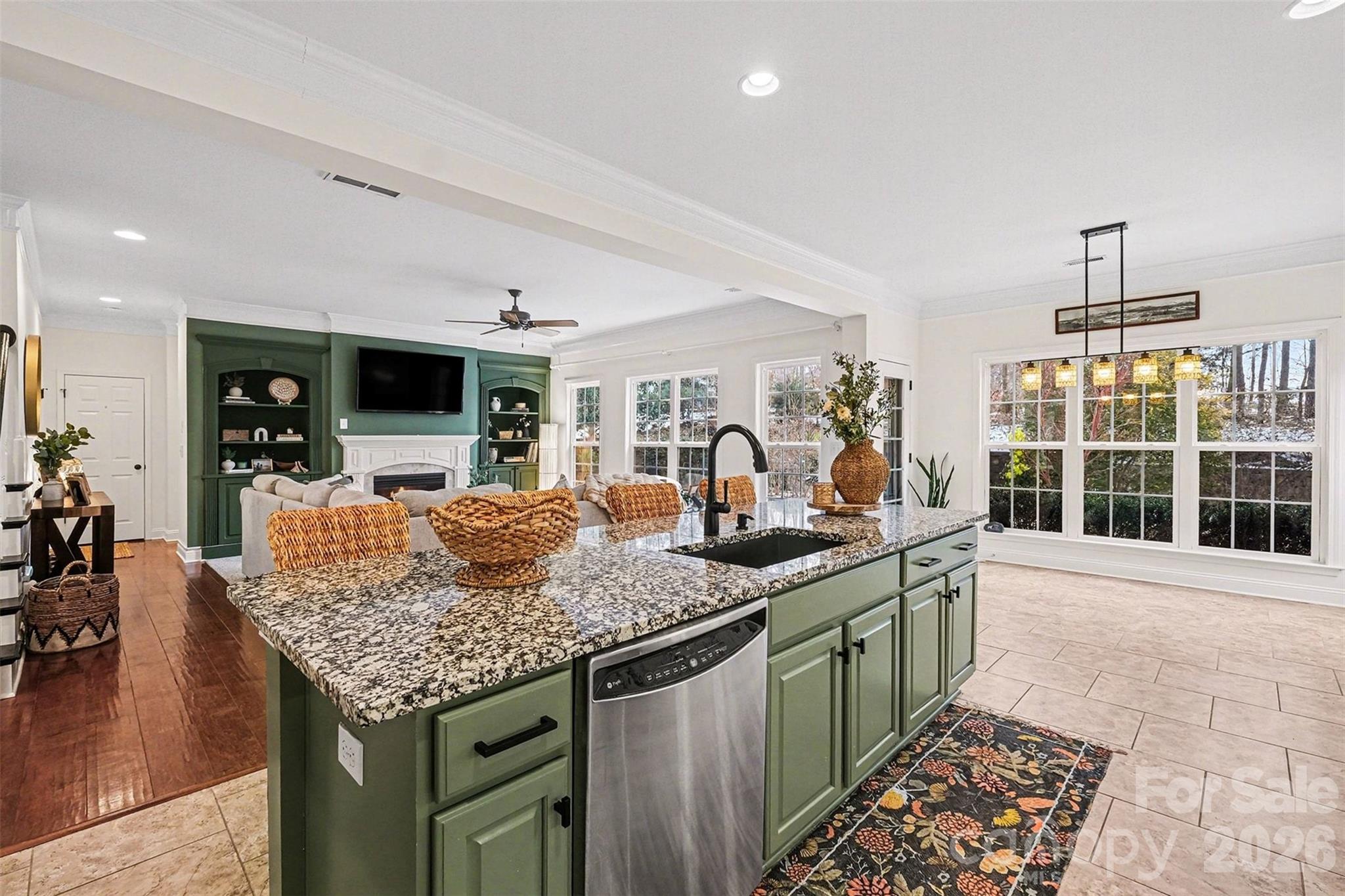 126 Burtons Barn Road Mooresville, NC 28115 - Photo 23 of 48 a kitchen with stainless steel appliances granite countertop a sink and cabinets