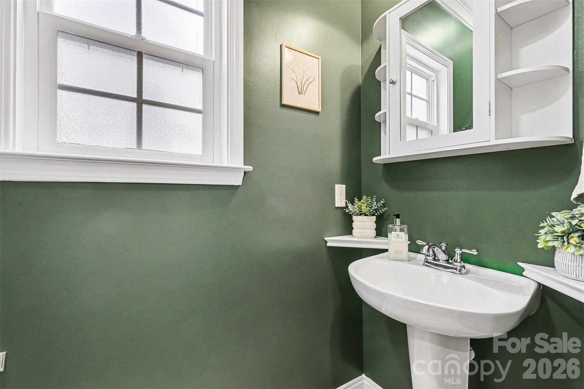 126 Burtons Barn Road Mooresville, NC 28115 - Photo 26 of 48 a bathroom with a sink and a mirror