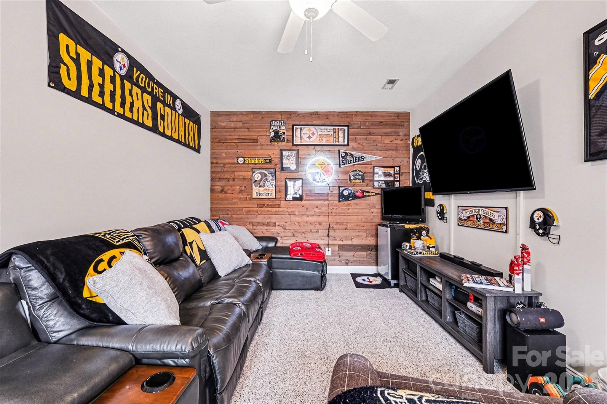 126 Burtons Barn Road Mooresville, NC 28115 - Photo 29 of 48 a living room with furniture and a flat screen tv