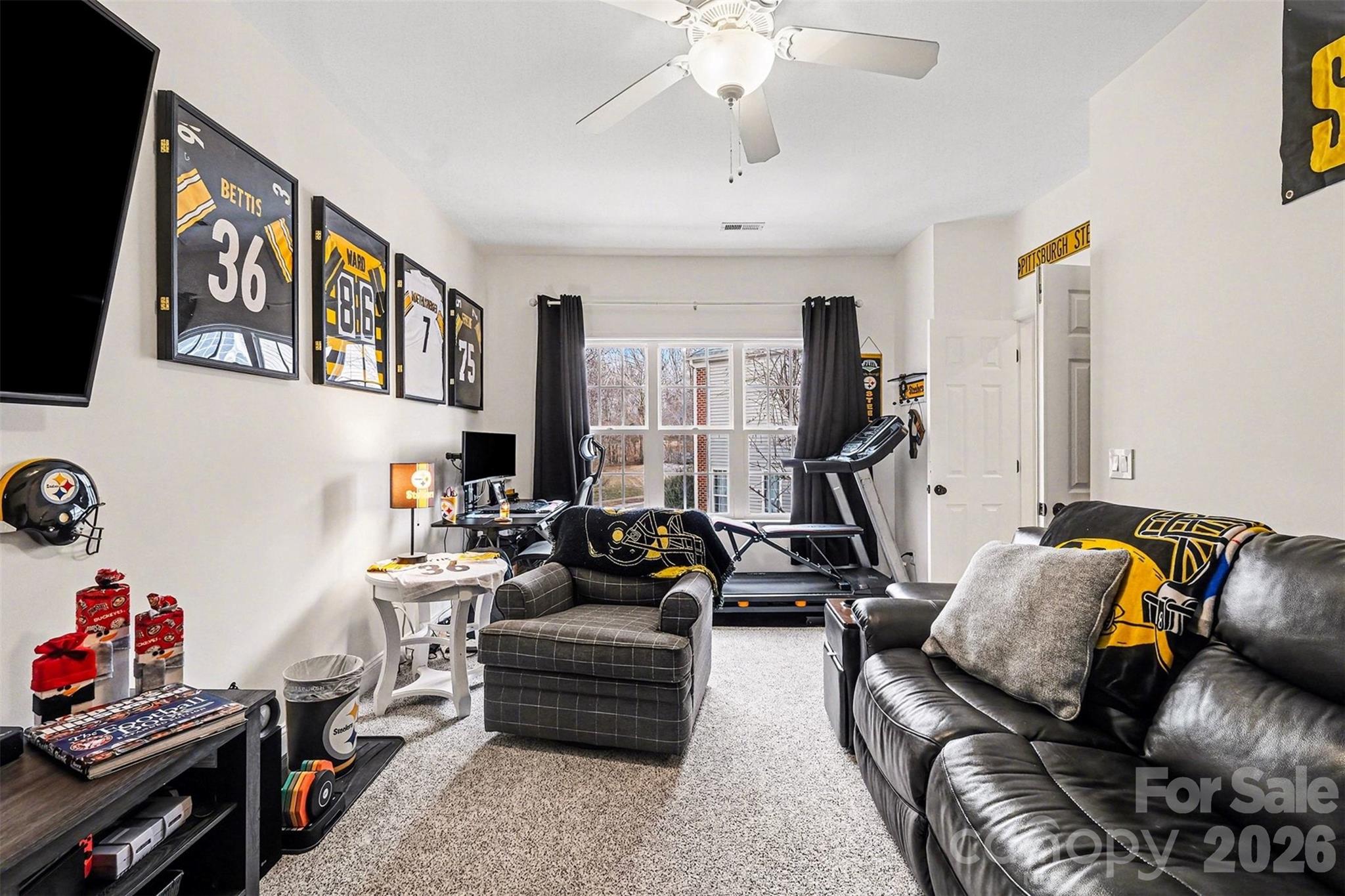 126 Burtons Barn Road Mooresville, NC 28115 - Photo 30 of 48 a living room with furniture a couch and a chandelier