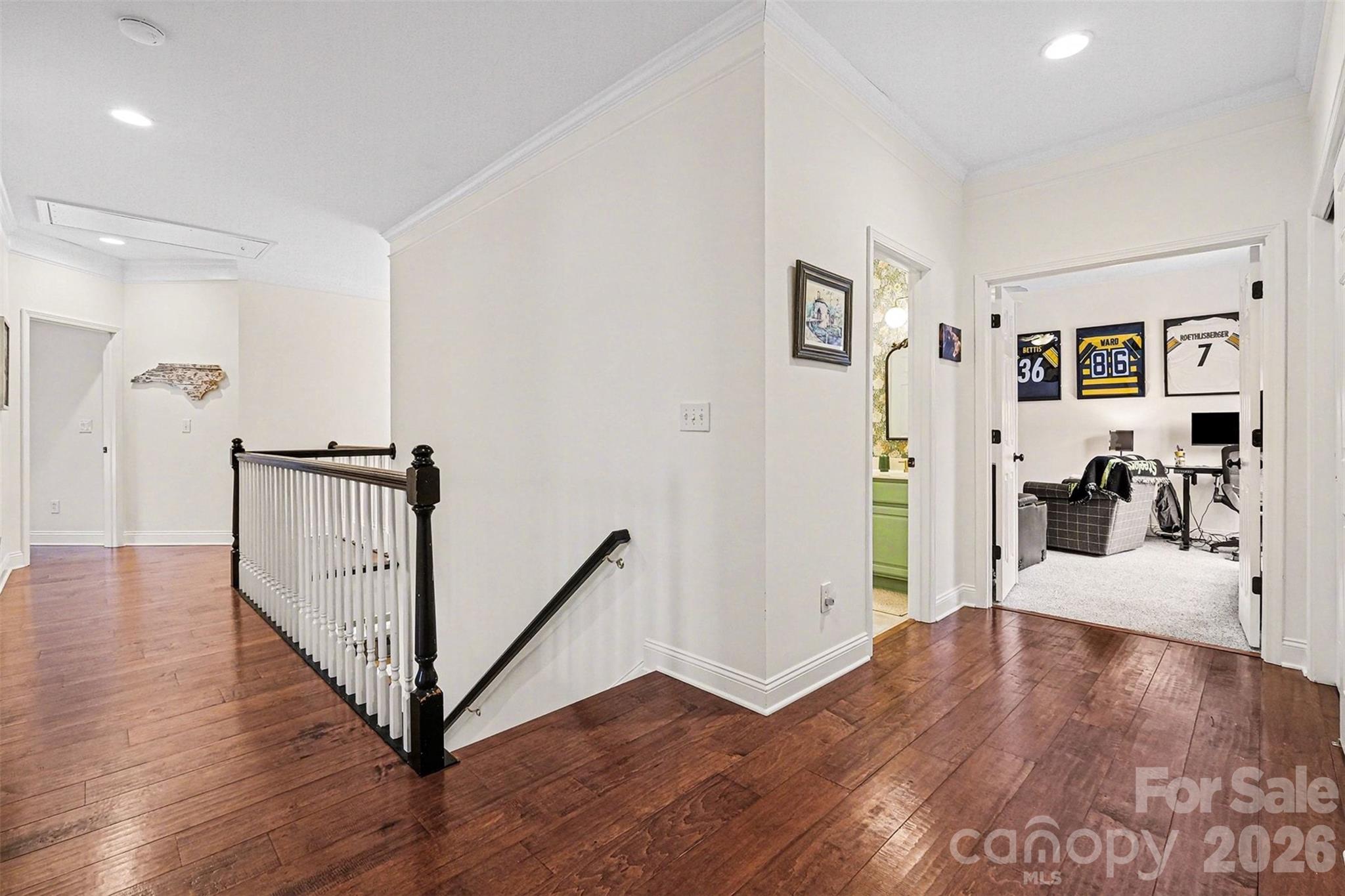 126 Burtons Barn Road Mooresville, NC 28115 - Photo 32 of 48 a view of a hallway with wooden floor and dining room view