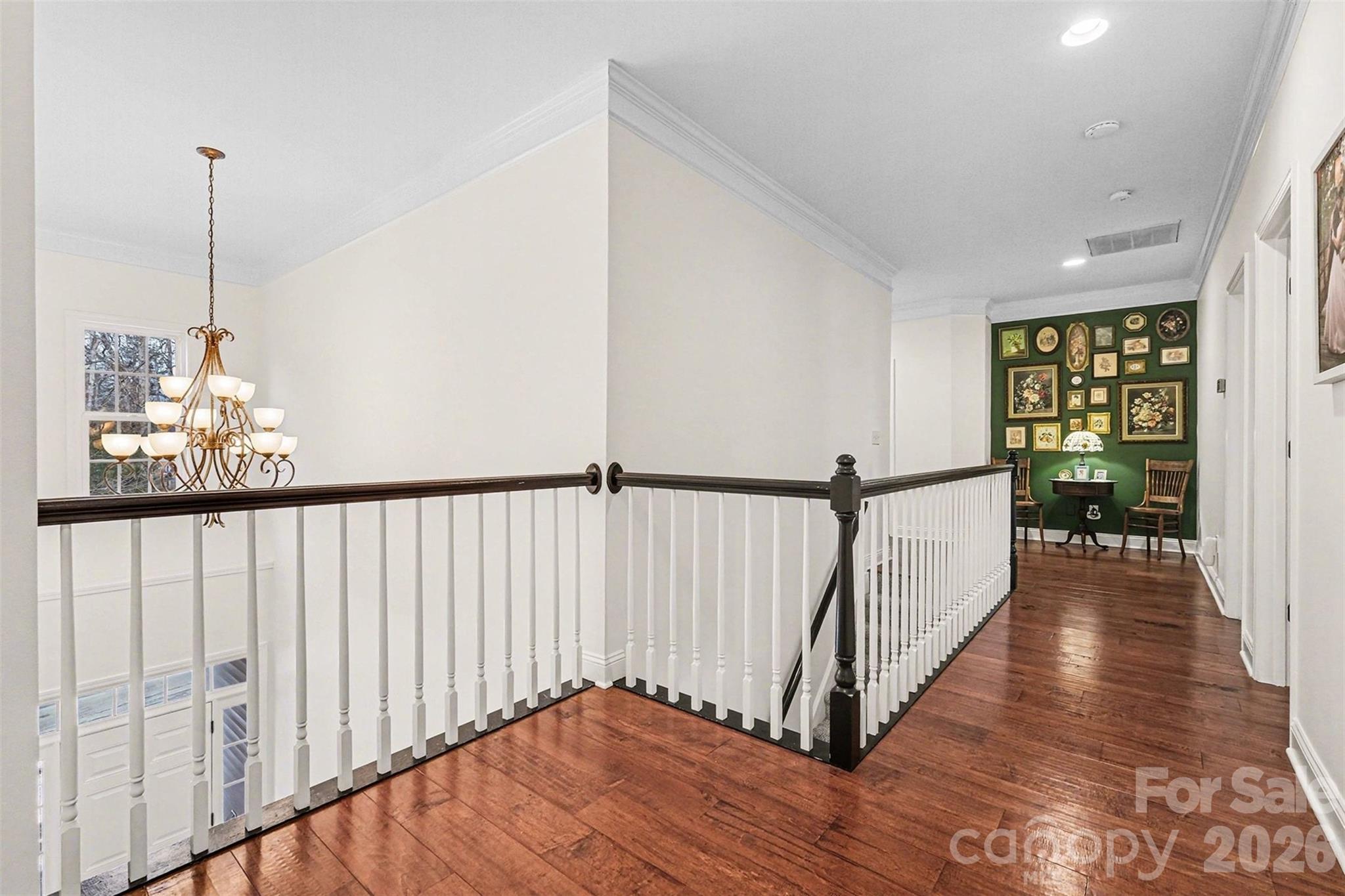 126 Burtons Barn Road Mooresville, NC 28115 - Photo 33 of 48 a view of a hallway view with wooden floor and staircase