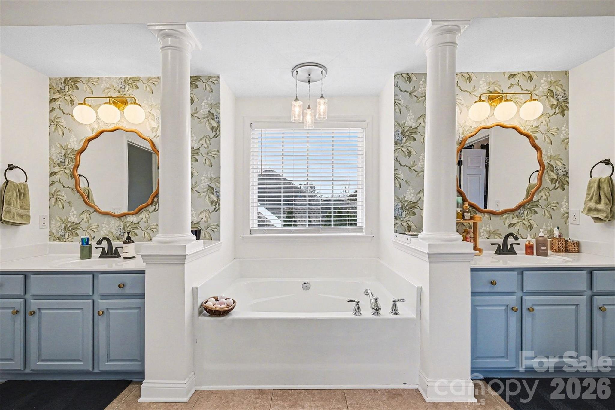 126 Burtons Barn Road Mooresville, NC 28115 - Photo 38 of 48 a bathroom with a tub sink and mirror