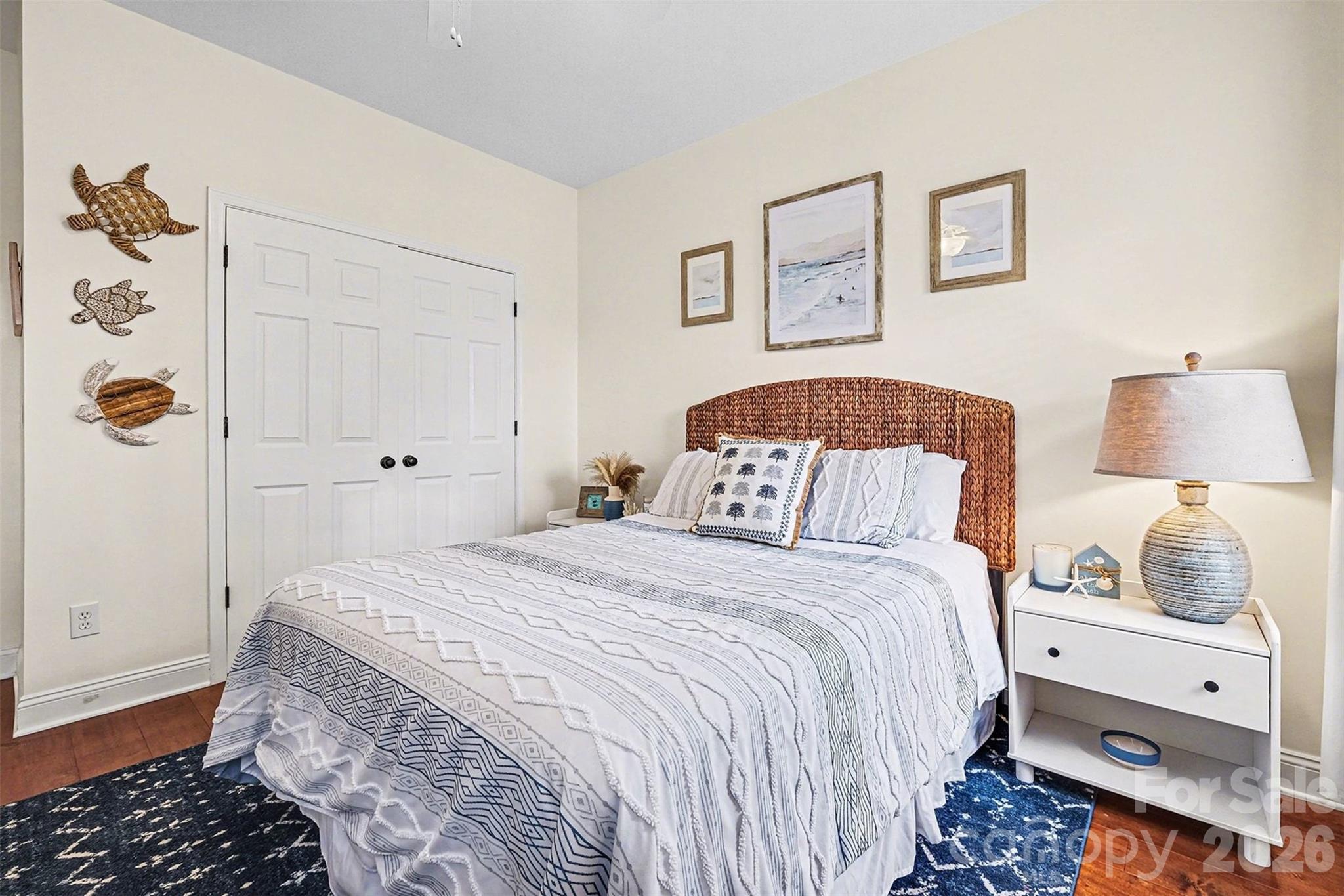 126 Burtons Barn Road Mooresville, NC 28115 - Photo 42 of 48 a bedroom with a bed and wooden floor