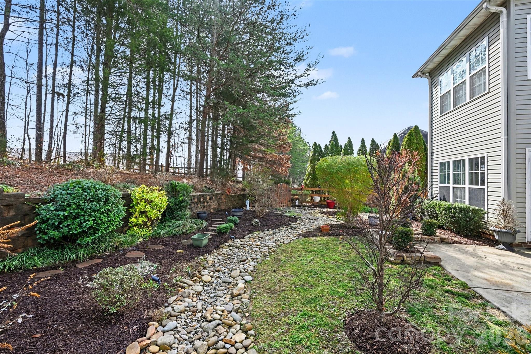 126 Burtons Barn Road Mooresville, NC 28115 - Photo 46 of 48 a couple of table and chairs in the garden