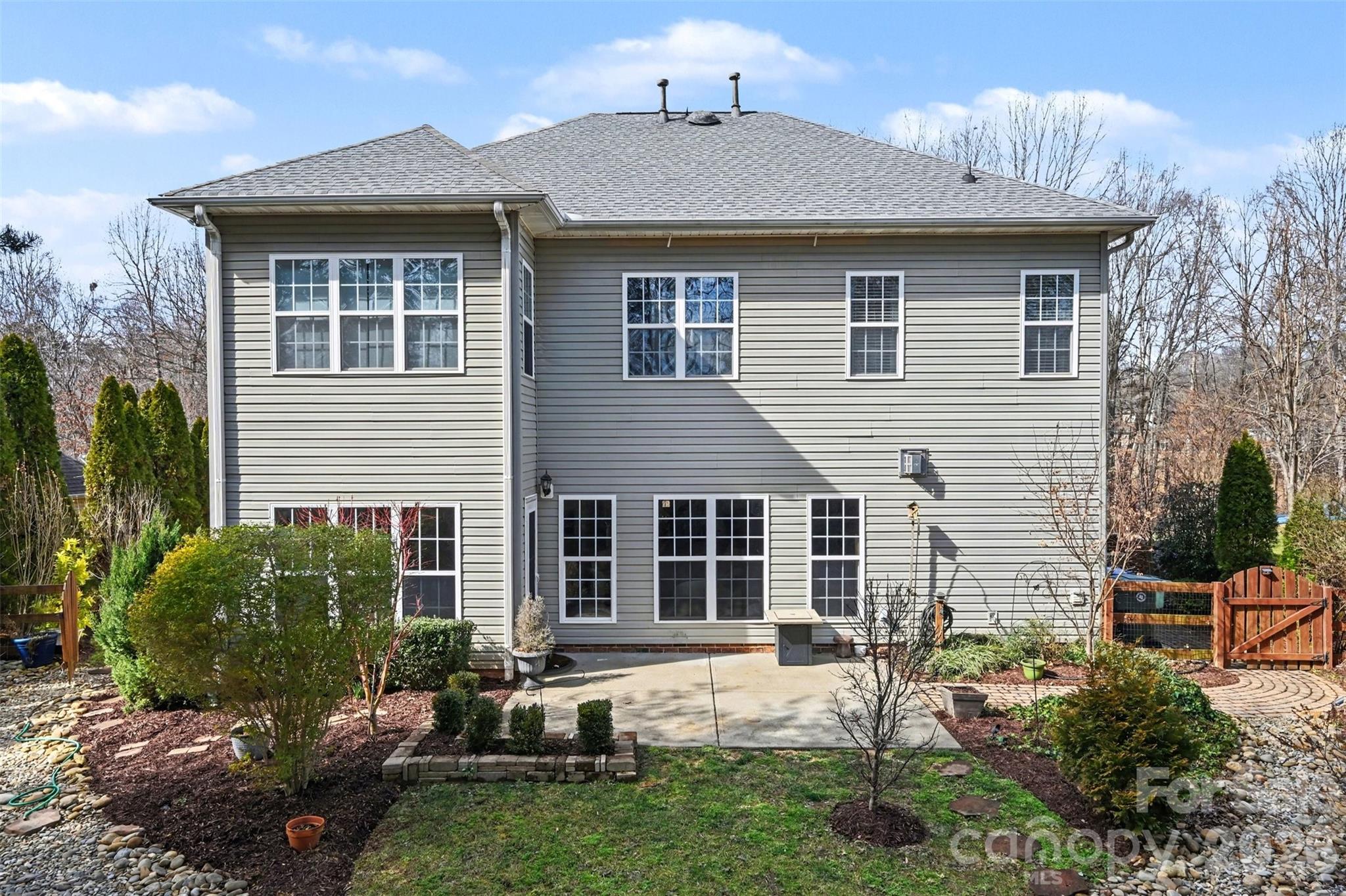126 Burtons Barn Road Mooresville, NC 28115 - Photo 48 of 48 a front view of a house with a yard