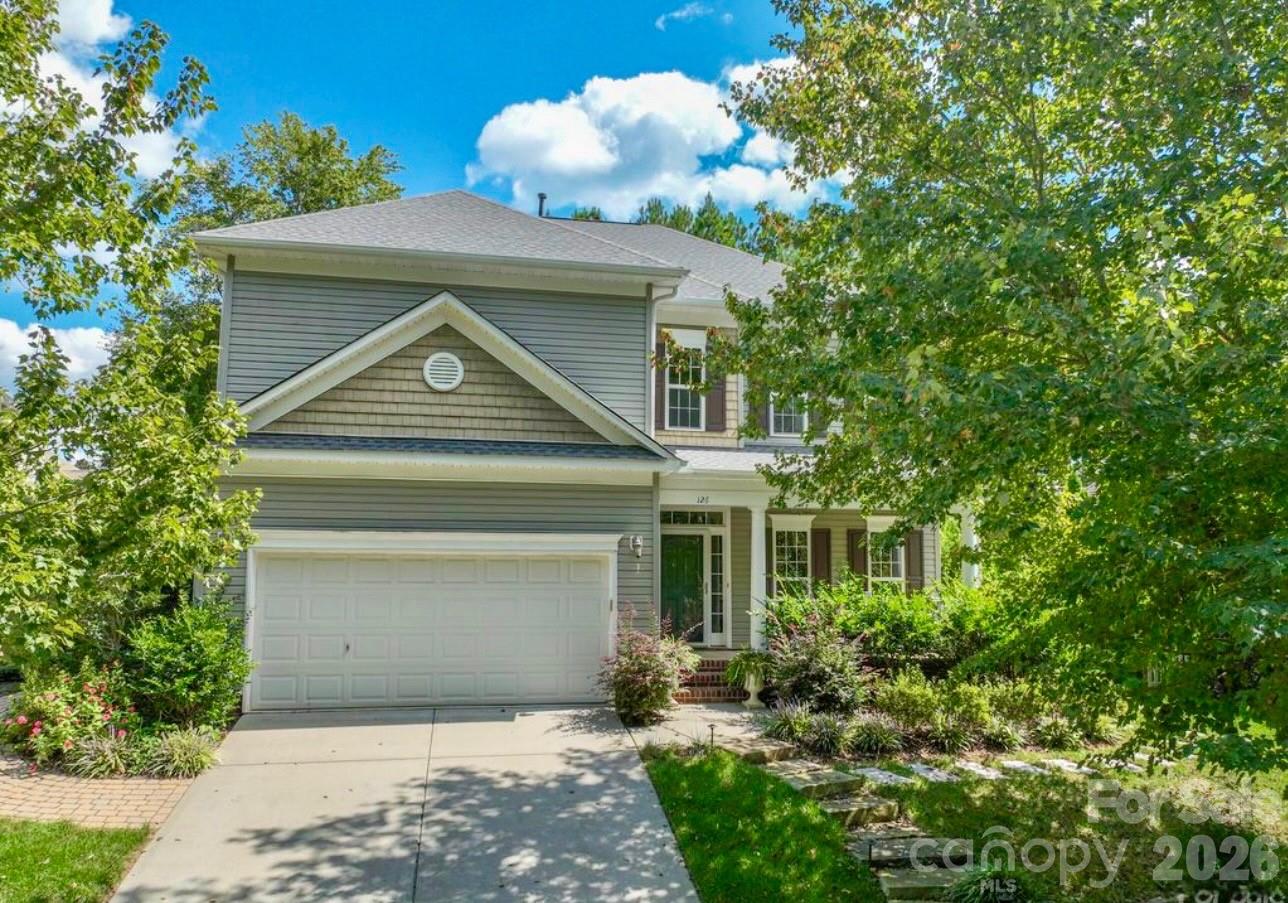 126 Burtons Barn Road Mooresville, NC 28115 - Photo 5 of 48 a front view of a house with a yard and garage