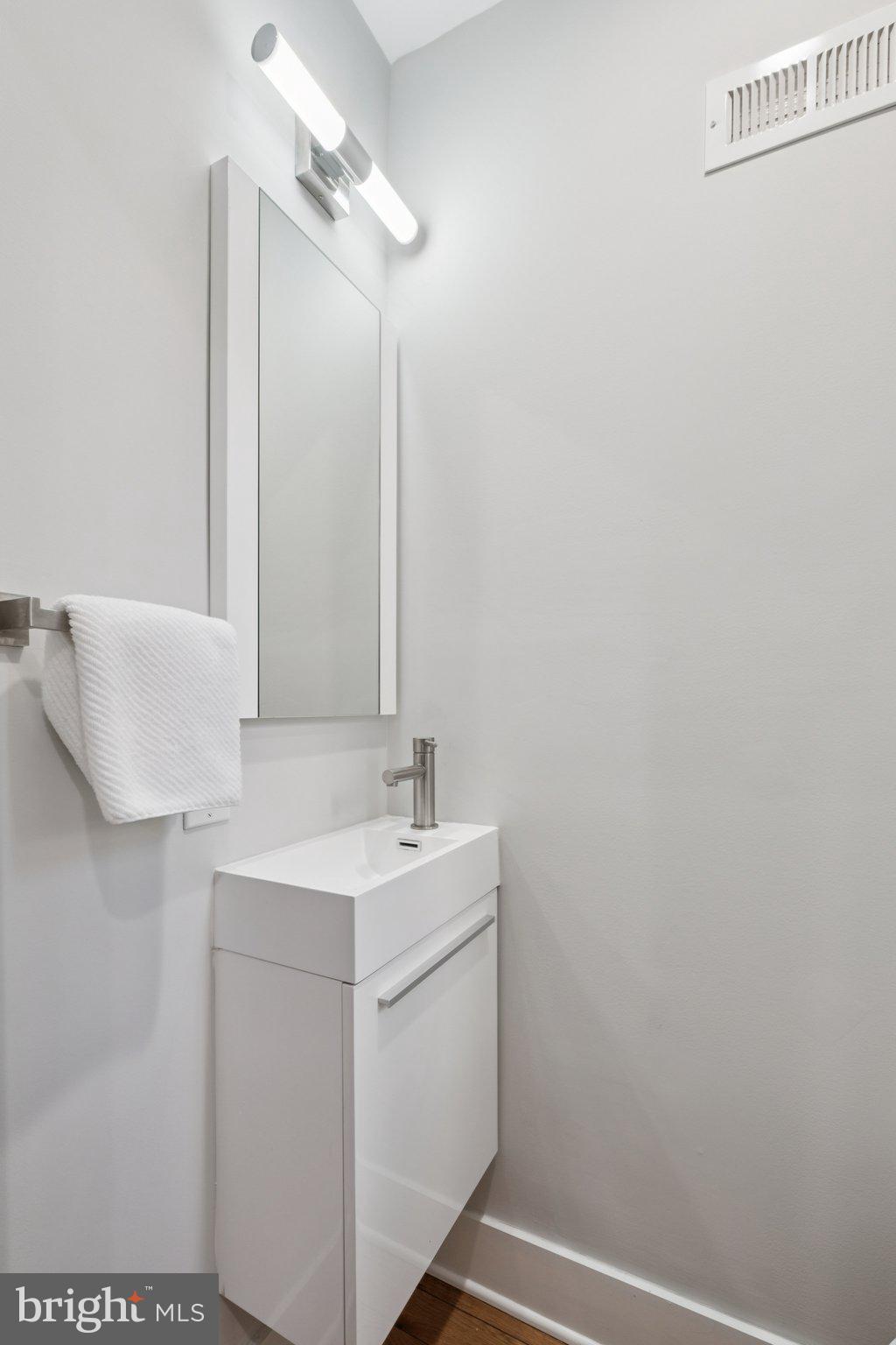 1811 Wilder Street Philadelphia, PA 19146 - Photo 15 of 37 a bathroom with a sink and a mirror