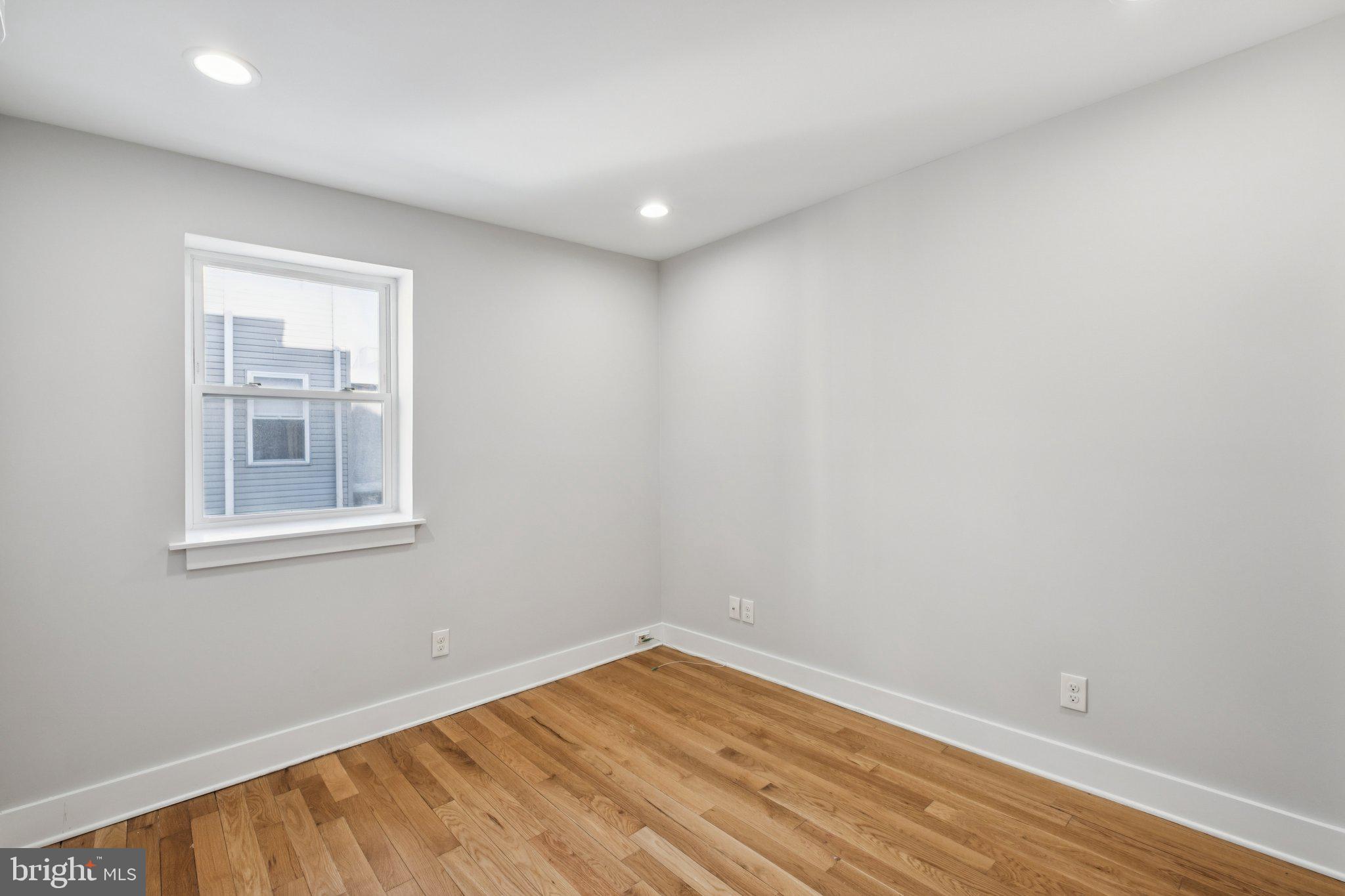 1811 Wilder Street Philadelphia, PA 19146 - Photo 18 of 37 a view of empty room with wooden floor and fan