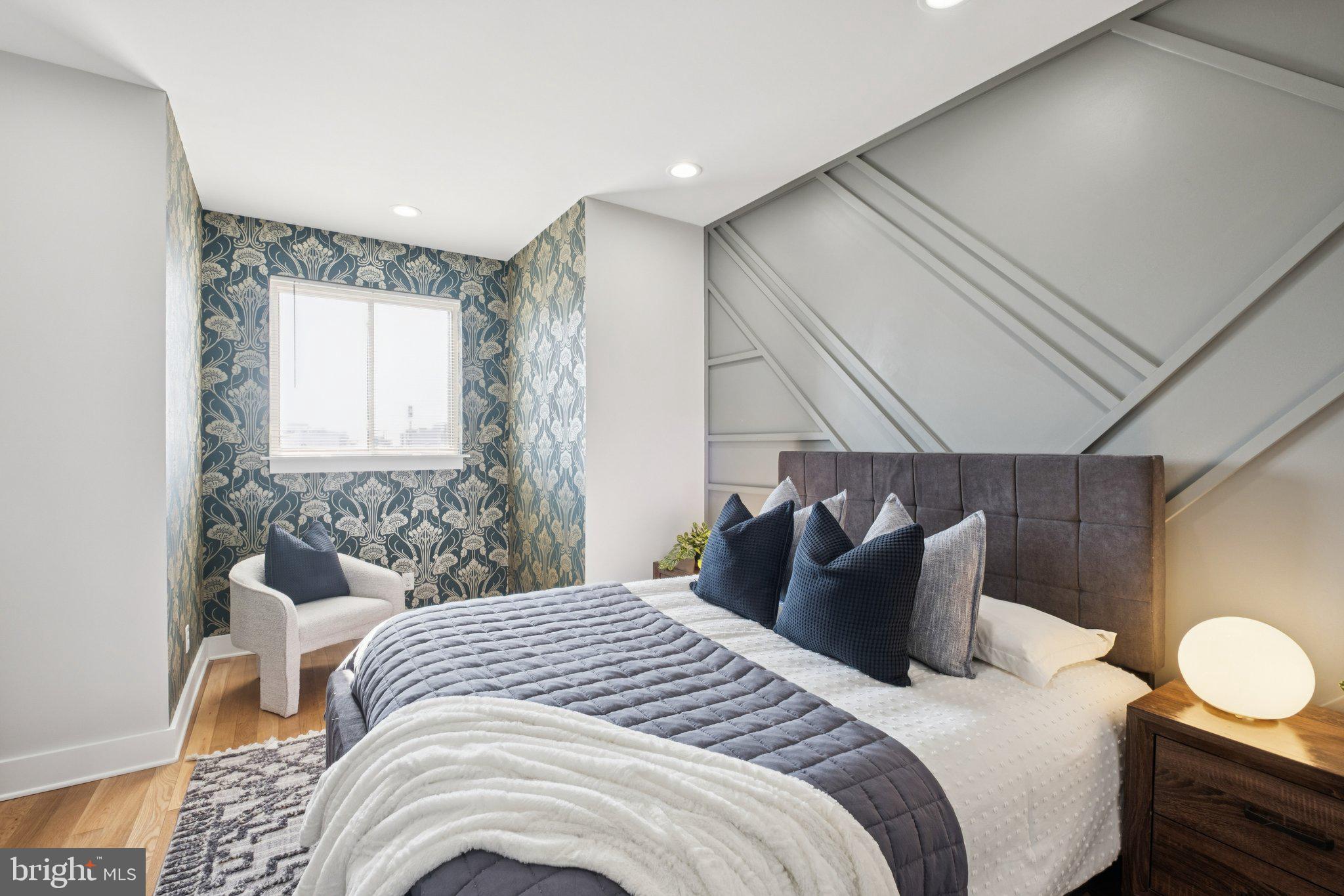 1811 Wilder Street Philadelphia, PA 19146 - Photo 25 of 37 a bedroom with a bed and wooden floor