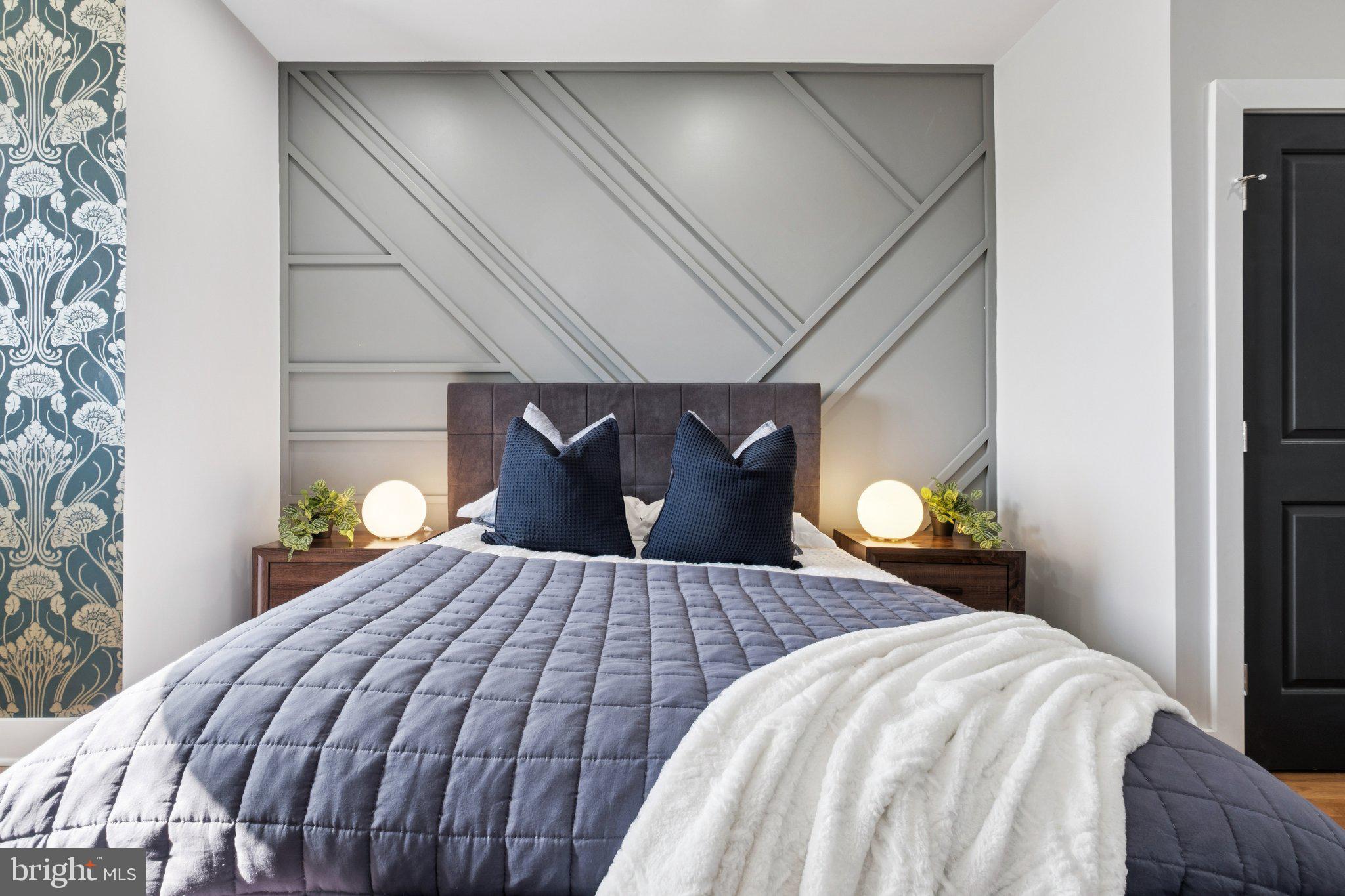 1811 Wilder Street Philadelphia, PA 19146 - Photo 30 of 37 a bedroom with a bed and lamps