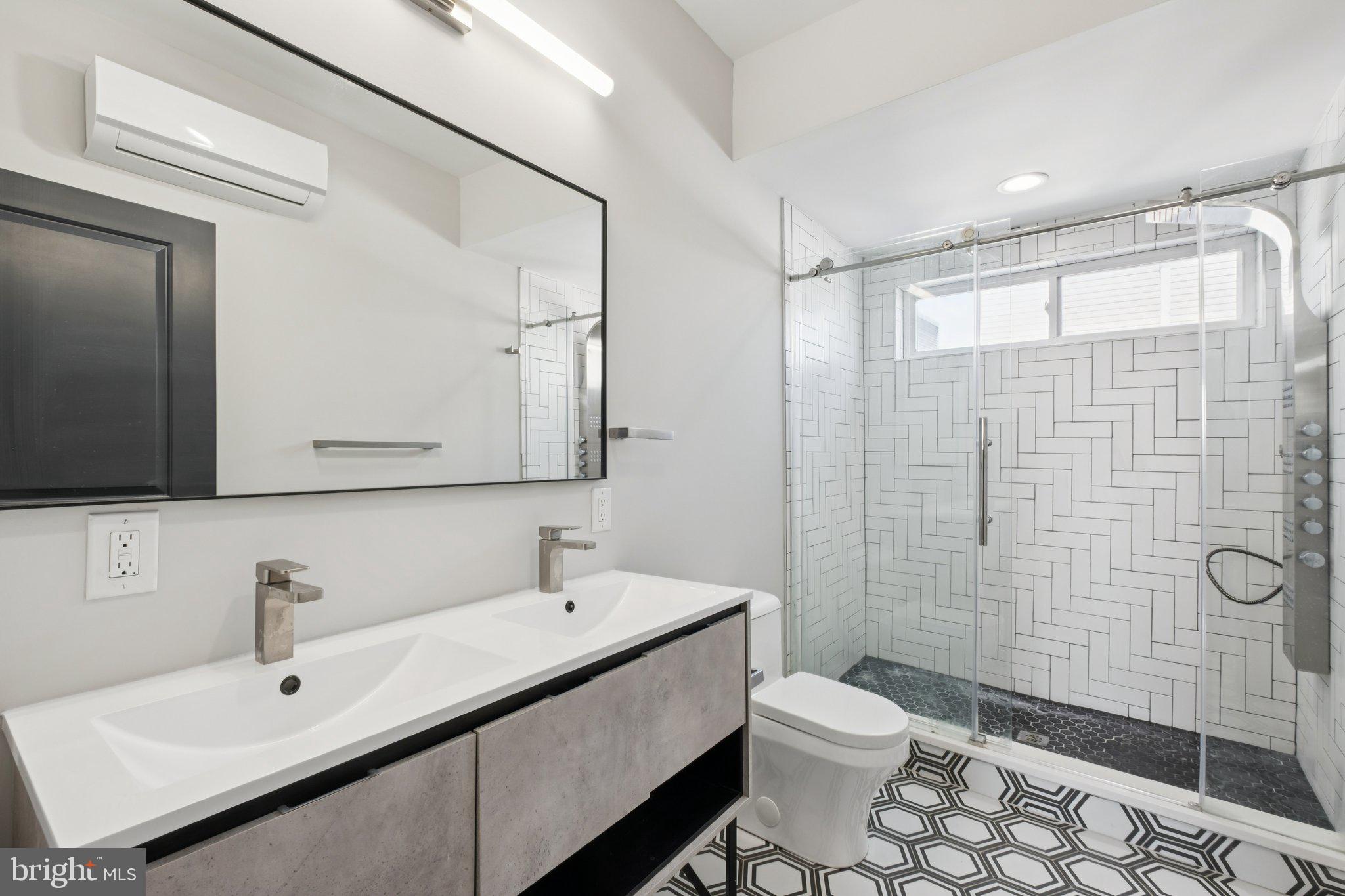 1811 Wilder Street Philadelphia, PA 19146 - Photo 31 of 37 a bathroom with a sink a toilet and shower