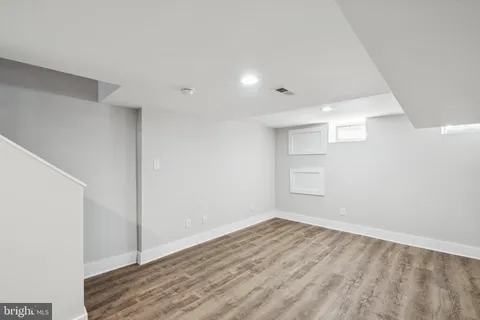 an empty room with wooden floor
