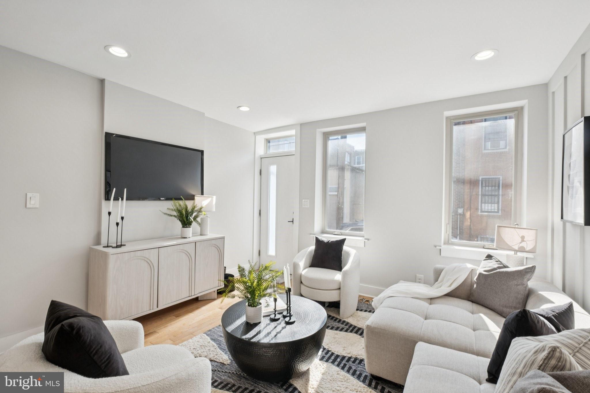 1811 Wilder Street Philadelphia, PA 19146 - Photo 5 of 37 a living room with furniture and a flat screen tv