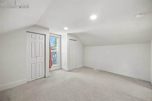 an empty room with closet area
