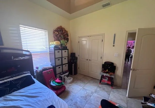 a bathroom with a shower curtain and a shower