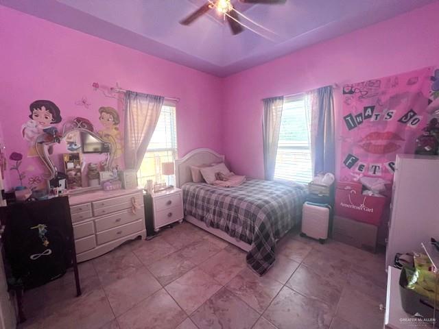 2102 Stone Gate Drive Harlingen, TX 78552 - Photo 30 of 35 a spacious bedroom with a bed and a chandelier