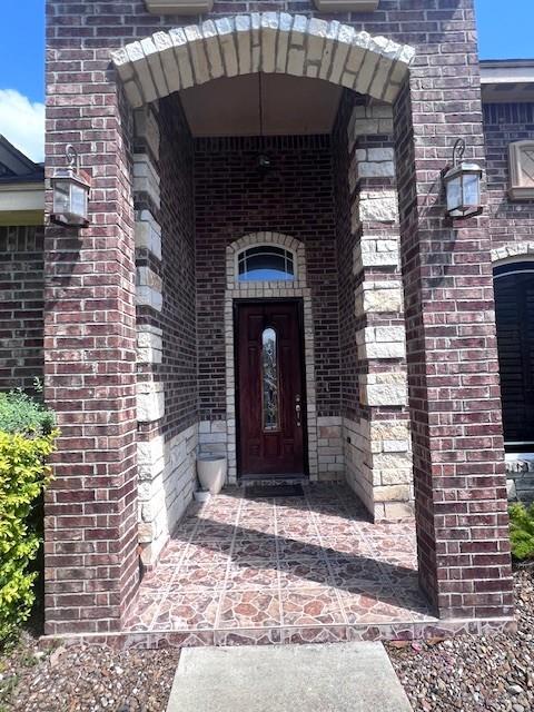 2102 Stone Gate Drive Harlingen, TX 78552 - Photo 4 of 35 a front view of a house with a yard