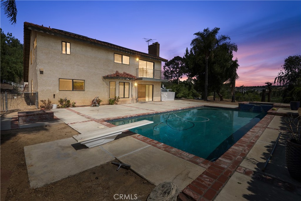17656 Mockingbird Hill Circle Riverside, CA 92504 - Photo 38 of 49 a view of a house with a yard