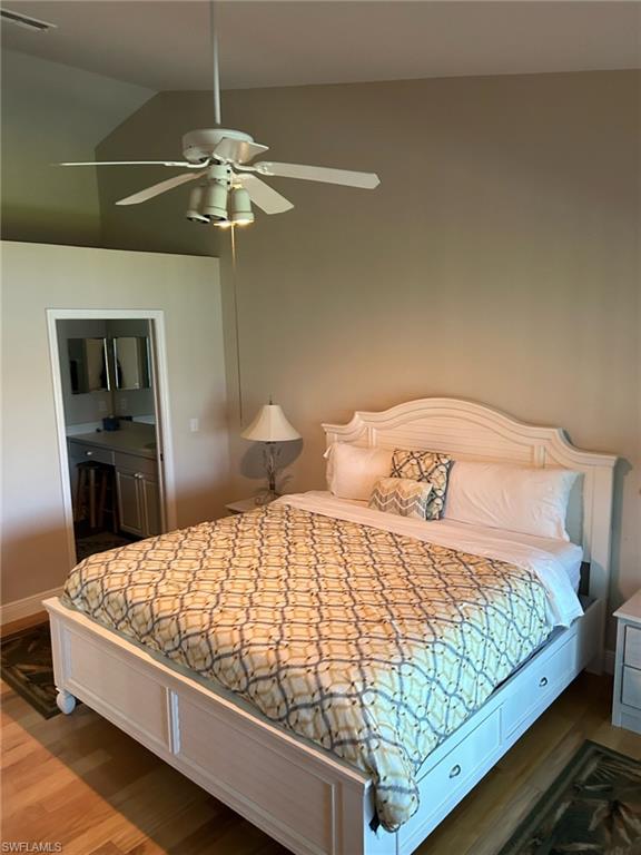 3685 Stone Way Estero, FL 33928 - Photo 20 of 27 a bedroom with a bed and dresser