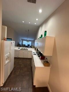 3685 Stone Way Estero, FL 33928 - Photo 4 of 27 a kitchen with refrigerator and cabinets